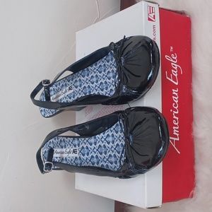New in box American Eagle Black Lacross Wedge Sandals Vegan patent leather